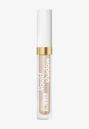 Tubetto trasparente di ombretto liquido beige scintillante con tappo bianco e banda dorata, etichettato "Revlon Glimmer Liquid Shadow."