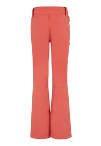 Pantaloni da sci donna di colore corallo, realizzati in tessuto morbido e flessibile con gamba a campana, dotati di tasche con zip e una finitura liscia.