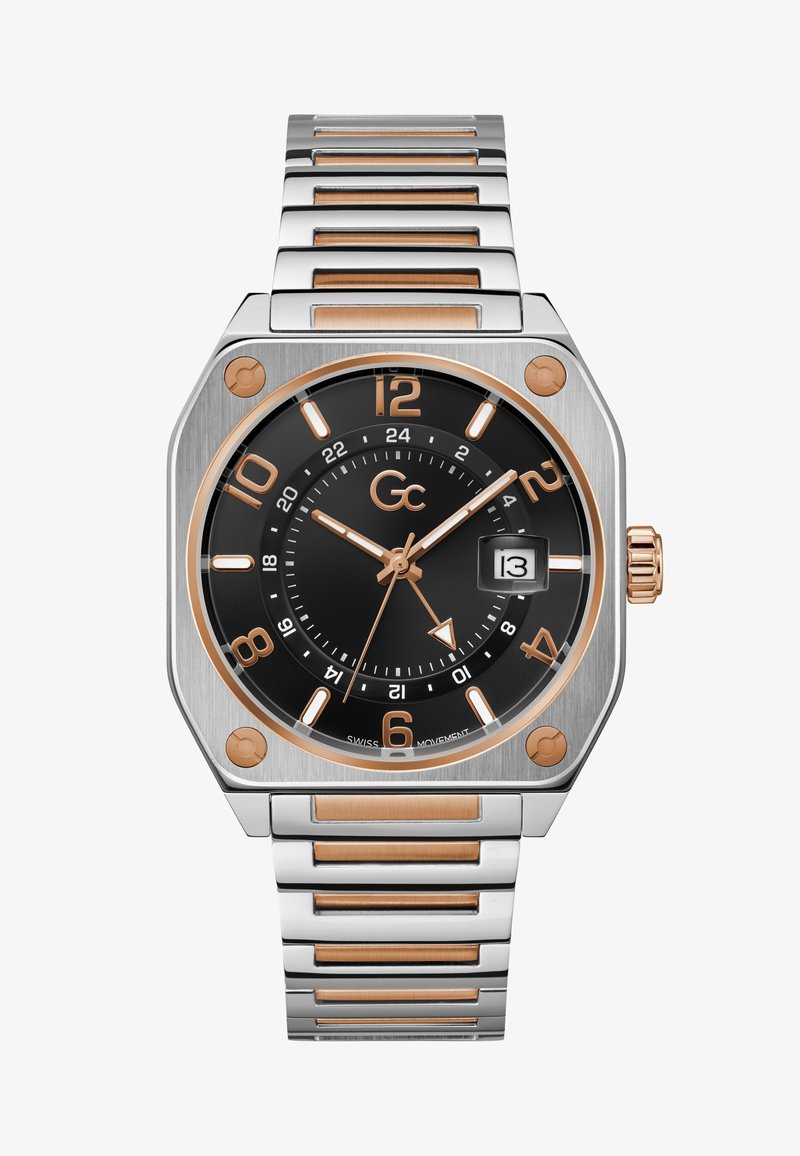 Kandiline roostevabast terasest kell musta kelladialiga, roosa kuldne aktsentide ja tunni markeritega. Omab kuupäevaaken ja metalllinkidega käevõru.