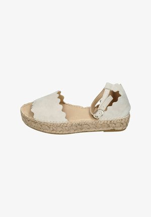 White suede espadrille sandal with a scalloped edge, jute-covered wedge sole, adjustable ankle strap, and a smooth interior lining.