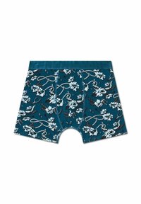 Turkosa kalsonger med blommönster som har vita blommor och svarta accenter, mjukt tyg och ett brett turkost midjeband.