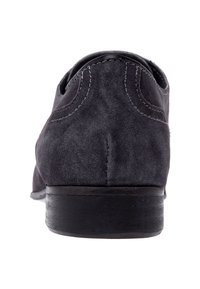 Scarpa in suede grigio scuro con forma arrotondata, dettagli di cucitura discreti e suola in pelle nera. Il profilo posteriore mostra una texture liscia.