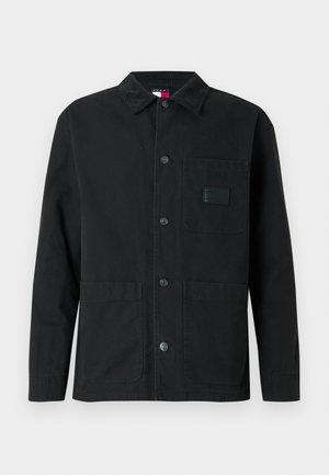 Schwarze Jacke aus Baumwolle mit Cordkragen, Fronttaschen und Knopfverschluss. Enthält ein quadratisches Etikett auf der Brusttasche.