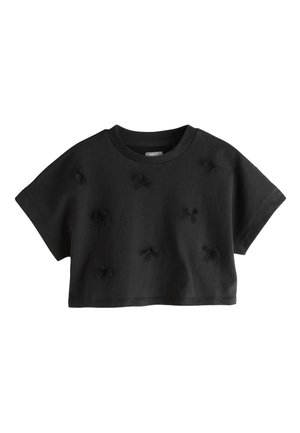 Čierny krátky top s krátkym rukávom, okrúhlym výstrihom a viacerými detailmi uzlov z látky roztrúsenými vpredu.