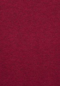 Vinskott bomullstyg med en mjuk, något texturerad väv; enhetlig färg genom hela tyget utan synliga mönster eller detaljer.