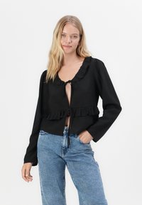 Noisy May NMYOLANDA - Wide leg - medium blue denim