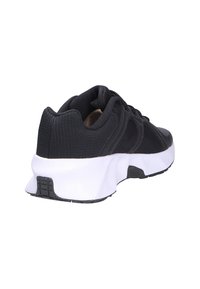 Scarpa sportiva nera con tomaia in tessuto testurizzato, suola intermedia bianca e suola esterna in gomma nera. Design con allacciatura e colletto imbottito.