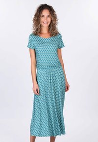 Fliederne, türkisfarbene Bluse mit floralem Print, kurzen Ärmeln, tailliertem Schnitt und knielangem Rock, aus glattem Material mit wiederholtem Blattmuster.