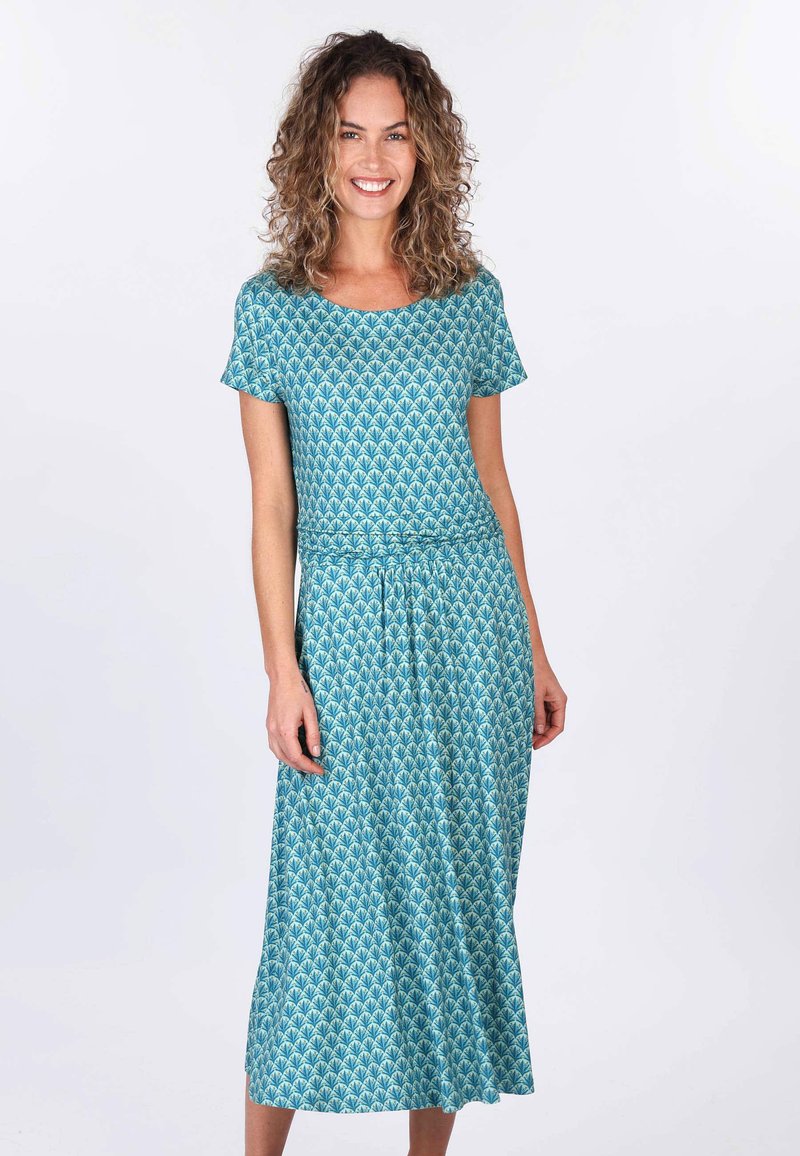 Fliederne, türkisfarbene Bluse mit floralem Print, kurzen Ärmeln, tailliertem Schnitt und knielangem Rock, aus glattem Material mit wiederholtem Blattmuster.