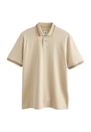 Beige polo shirt with a classic collar, three-button placket, and patterned accents on the collar and sleeves. Soft cotton material.