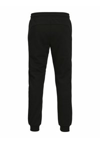 Zwarte sweatpants van zachte stof met een elastische tailleband, die naar de enkels toelopen, en met accentpanelen aan de zijkanten.