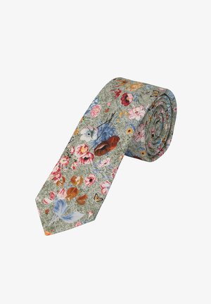 Blumenfliegen in grünem Stoff, mit einer Vielzahl von bunten Blumen und Schmetterlingen. Schlankes Design mit einer strukturierten Optik.