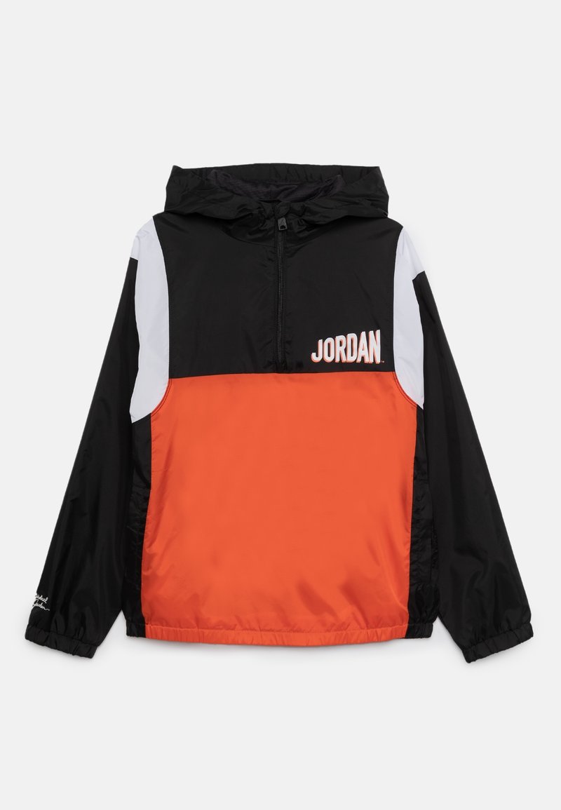 Black and orange windbreaker jacket with a hood, half-zip front, and white accents. Features "JORDAN" text on the chest area.
