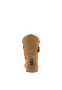 Botines de ante marrón con un acabado texturizado, forro de pelo sintético blanco, correa ajustable y suela de goma con un logo en la parte trasera.