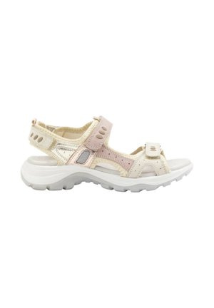Sandalias ligeras con un diseño en beige y rosa, que presentan correas ajustables, cortes y una suela blanca gruesa para mayor comodidad.