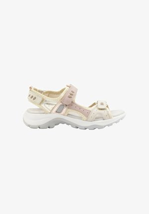 Sandalias ligeras con un diseño en beige y rosa, que presentan correas ajustables, cortes y una suela blanca gruesa para mayor comodidad.
