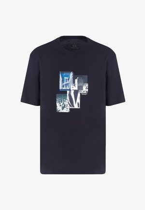 Navy blue cotton T-shirt featuring a collage of monochrome and blue graphic prints on the front, round neck, and short sleeves.