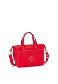 Red nylon handbag with dual top handles, detachable shoulder strap, zip closure, and embossed logo detail on the front.