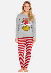 Maglietta grigia a maniche lunghe con grafica del Grinch e testo "Feelin' Grinchy". Pantaloni da pigiama a righe rosse e grigie con un taglio comodo. Materiale misto cotone.