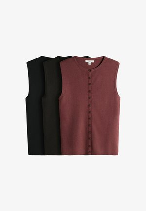 Trois hauts sans manches à boutons côtelés en noir, olive foncé et mauve, disposés en chevauchement sur fond blanc.