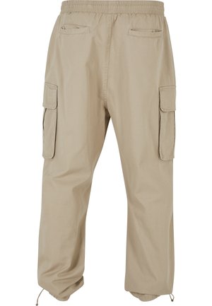 Beige cargo pants with elastic waistband, two side flap pockets, two back welt pockets, and adjustable drawstrings at the cuffs.
