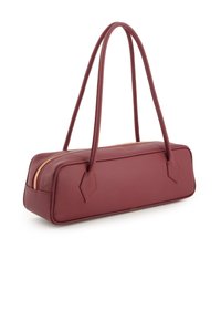 Burgundy leather handbag with a rectangular shape, two slender handles, and a gold zipper closure. Features angled side accents.