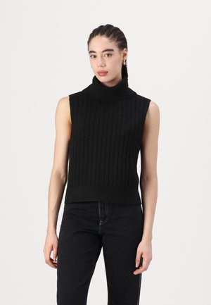 Black, sleeveless turtleneck sweater with vertical ribbing texture, featuring a fitted silhouette and solid color. Paired with dark jeans.