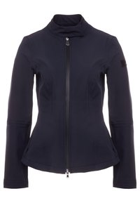 Navy softshell jacket with a high collar, full front zipper, and tapered design; features zippered side pockets and a patch on the sleeve.