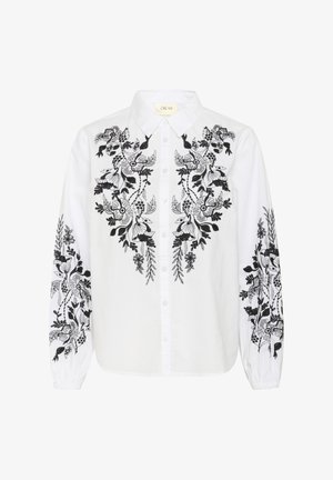 Biała koszula z misternym czarnym haftem przedstawiającym kwiaty i liście; zapinana na guziki, z długimi rękawami i klasycznym kołnierzykiem.