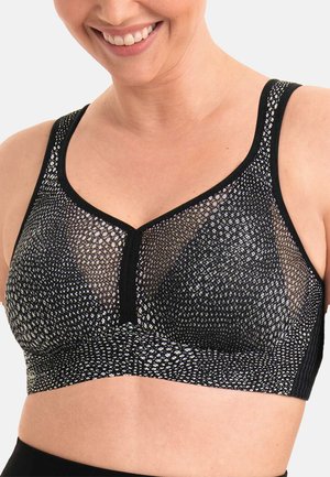 Soutien-gorge noir avec un design en mesh texturé, mettant en avant des accents argentés. Il possède des bretelles larges et un décolleté en V, offrant un ajustement confortable.