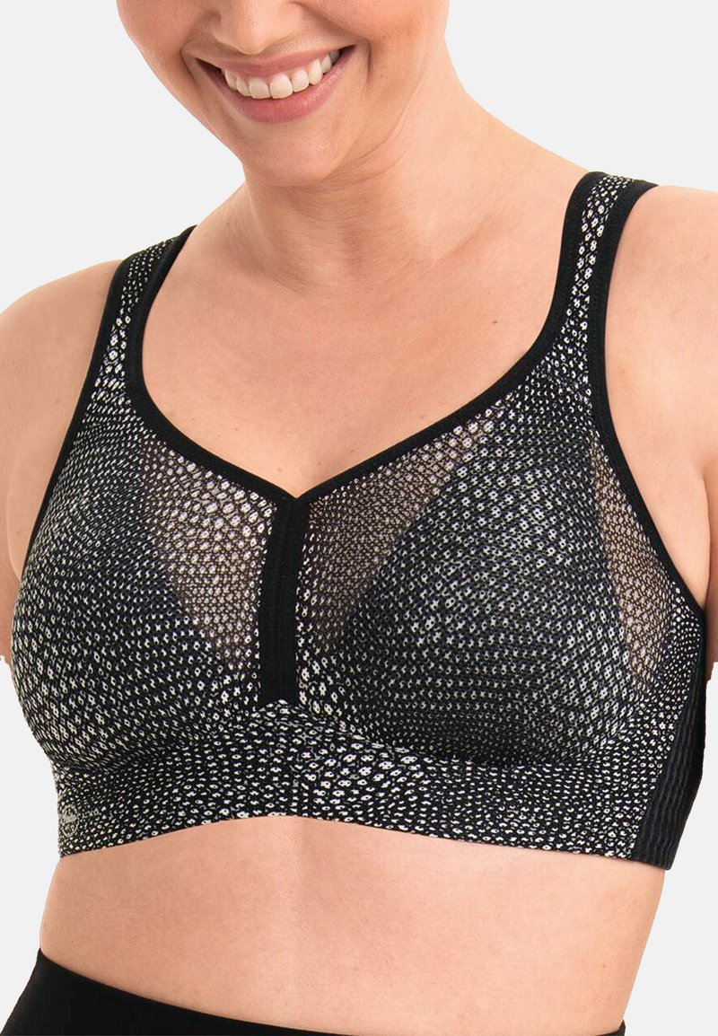 Sort bh med et struktureret mesh-design, der har sølvforbindelser. Den har brede stropper og en V-halsudskæring, som giver en behagelig pasform.
