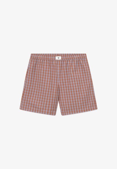 Boxer pour hommes à carreaux gris et orange avec ceinture élastique et petite étiquette logo blanche centrée en haut.