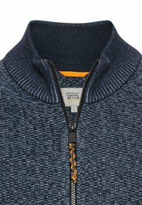 Marinefarbener Zip-Pullover mit hohem Kragen, strukturiertem Stoff, orangefarbenem Akzent innen und einem schwarzen Reißverschluss. Verfügt über ein Logotag mit der Größe L.