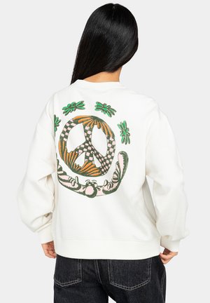 Hvid sweatshirt med et farverigt fredssymbol og blomsterdesign broderet på ryggen. Løs pasform med ribkantede manchetter og kant.