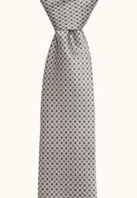 Silk tie with a geometric pattern of alternating circles in gray and white. Smooth texture with a wide end and classic design.