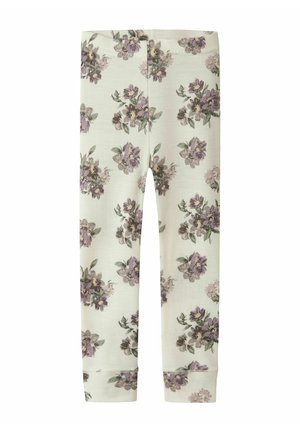 Leggings floraux en tissu doux et extensible, avec un fond crème clair orné de fleurs violettes et de feuilles vertes. Relevés aux chevilles.