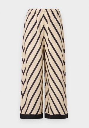 Beige wide-leg trousers featuring a diagonal black stripe pattern, an elastic waistband, and a contrasting black hem at the cuffs.
