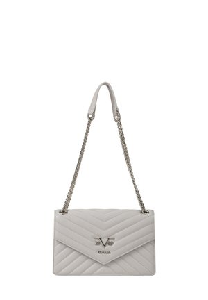 White quilted leather shoulder bag with silver chain strap and central metal "V ITALIA" logo on flap closure.