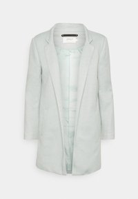 Ljusgrå, midjelång kappa med slagkrage, två sidofickor och ett slätt innerfoder. Har en subtil struktur och en enkel design.