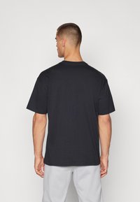 Nike Performance TEE - T-shirt con stampa - black