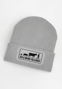 Gray knit beanie featuring a black graphic patch with farm animals and the text "ICH & MEINE FOLLOWER" in a rectangular border.
