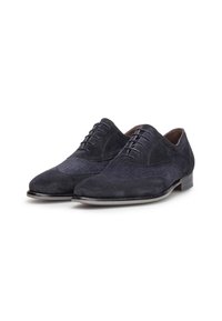 Scarpe da uomo in suede blu scuro con una texture a motivo, dettagli lisci e lacci, dotate di tacco basso.
