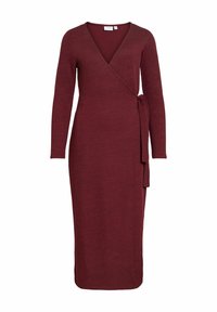 Robe portefeuille bordeaux en maille texturée, avec manches longues, décolleté plongeant en V et détail noué à la taille. Longueur midi.