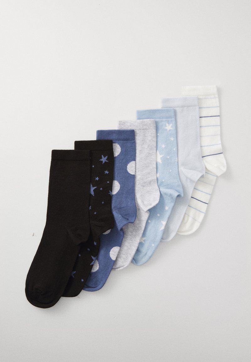 Set of eight socks featuring varied colors: black (with stars), navy blue (with dots), gray, light blue, and white (striped). Different textures.