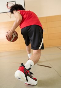adidas Performance TRAE UNLIMITED 2 - Scarpe da basket - better scarlet/core black