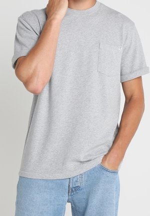 Gray short-sleeve t-shirt made of cotton, featuring a rounded neckline and a small chest pocket. Sweater has rolled sleeve cuffs.