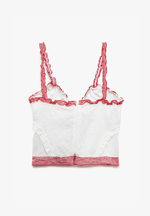 Hvid kort top med broderi, rød ternet kant og bølgede stropper. Besidder en frontlynlås og tætsiddende design.