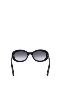 Lunettes de soleil ovales noires avec verres dégradés foncés et finition brillante, vues de face sur fond blanc.