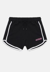 Μαύρο σορτς με κορδόνι στη μέση, λευκές λωρίδες στο πλάι και ροζ κεντημένο λογότυπο «GUESS» στο κάτω δεξί μέρος. Απαλή υφή υφάσματος.