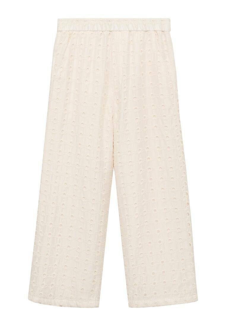Ljuskräm culotter gjorda av texturerat tyg, med ett subtilt prickmönster, elastisk midja och vida, korta ben.